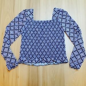 Lark + Grey Smocked Crop Top With Ruffled Hem.